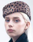 VERONICA - Asymmetric pillbox hat in leoperd-print wool.