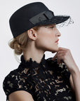 Misa Harada Hats | ALPHA | Porter’s cap in black wool felt with veiled peak and a grosgrain bow