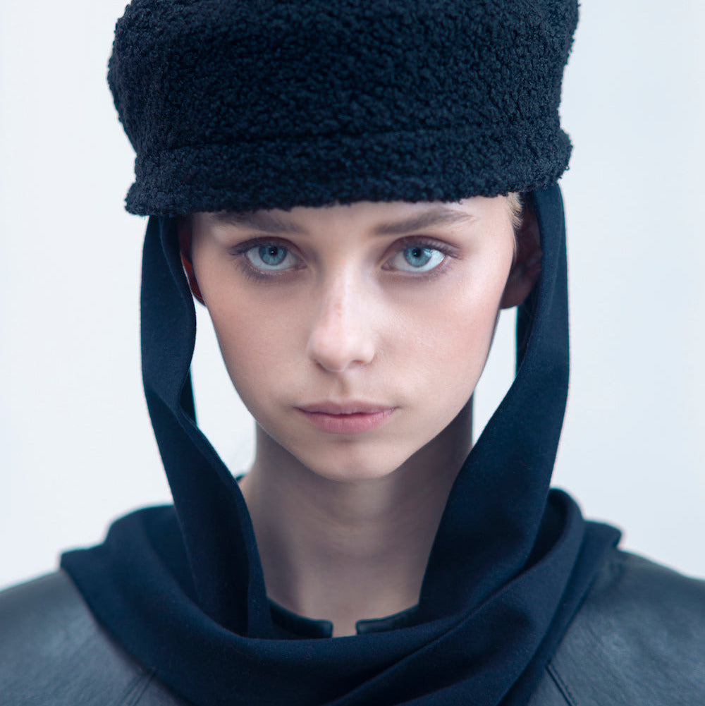 NOOR - Structured faux-sheepskin pillbox hat with jersey ties