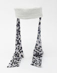 NOOR - Structured faux-sheepskin pillbox hat with jersey ties