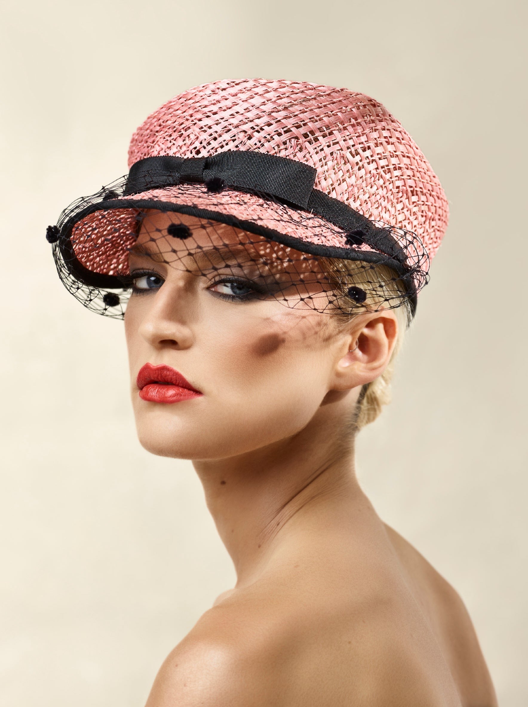 Misa Harada Hats| ANAIS | Asymmetric cap in pink ramie and jute mix, with black dotted veiled peak and grosgrain bow