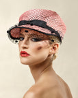 Misa Harada Hats| ANAIS | Asymmetric cap in pink ramie and jute mix, with black dotted veiled peak and grosgrain bow