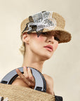 Misa Harada Hats| ARIA | Asymmetric cap in  maraca straw, with black and white 3D applique flowers